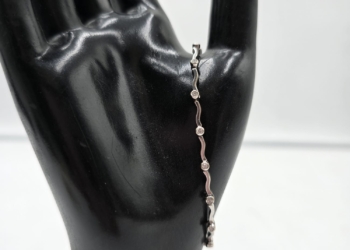 Bracciale Tennis ad Onde in Oro Bianco e Diamanti Naturali